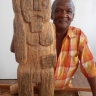 Ishmael Thyssen posing with his work -