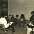 CAP guitar lessons (teacher sitting on chair)