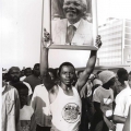 Young man displaying photo of Mandela, Defend Natal march, 7 July 1990 (photo - Jeeva Rajgopaul)
