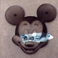 Mickey Mimic, 2002. Cement, décollage and perspex on board, 22 x 27 cm. (Image courtesy of the artist).