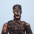 Cannon Fodder Ken, 2014. Various plastics, epoxy resin, steel, soot, 19- 26 cm. (Image courtesy of the artist).