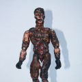 Cannon Fodder Ken 2014. Various plastics, epoxy resin, steel, soot, 19- 26 cm. (Image courtesy of the artist).