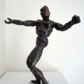 Collaterally Damaged Ken, 2014.  Various plastics, epoxy resin, steel, soot, 19- 26 cm. (Image courtesy of the artist).