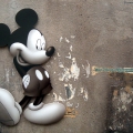 Mickey Mobster, 2002. Cement, décollage, soot, burnt bone fragments, ash, dust, acrylic, pencil, chalk, vinyl ink and Perspex on board, 70 X 55 cm. (Image courtesy of the artist).