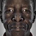 Faces of people who may or may not be victims or perpetrators of domestic violence (James), 2013. Pigment ink on cotton Baryta, 68 x 140 cm (Photo courtesy of artist)