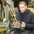 Blik'nSnaar, played. 1985. Oil tin, bamboo, animal gut strings and wood (Photo: Jurie Senekal)