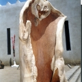 The eyes of the rabbit are the ears of the jackal aka Twentieth Century Fox, 1997. Cuban mahogany, 135 x 65 cm. (Collection: Diehleman Gallery, Brussels; (Photo: G Dixon) Note: The house designed by the artist is in the background