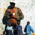 Isaac Nkululeko Makeleni - Carving a doll's head, Nyanga East, probably mid-to-late 1990s (Photo: courtesy M. Makeleni)