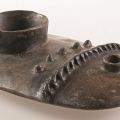 Flat container, 2013. Smoked terracotta. 6.8 x 23 x 14 cm. (Image courtesy of Durban Art Gallery)