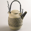 Teapot with Wire Handles, 1989. Stoneware and wire. 22.2 cm. (Image courtesy of Durban Art Gallery)