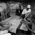 Playing Dominoes, 2003. From series ‘Chillaxing in the District’, photographs  from the Warwick Avenue Triangle, Durban. (Image courtesy of the artist)