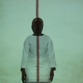 Kwa Baba rithi undugu (still I), 2010. Looped 2 channel video installation (15’30”, 4 : 3) with two sculptures (36 × 20 cm), dimensions variable. (Image courtesy of the artist).