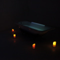 Part III: Nankondo, 2018. Installation featuring a bathtub, water, a text projection (text by Demere Kitunga), and lit candles, dimensions variable. (Photo courtesy of the artist).